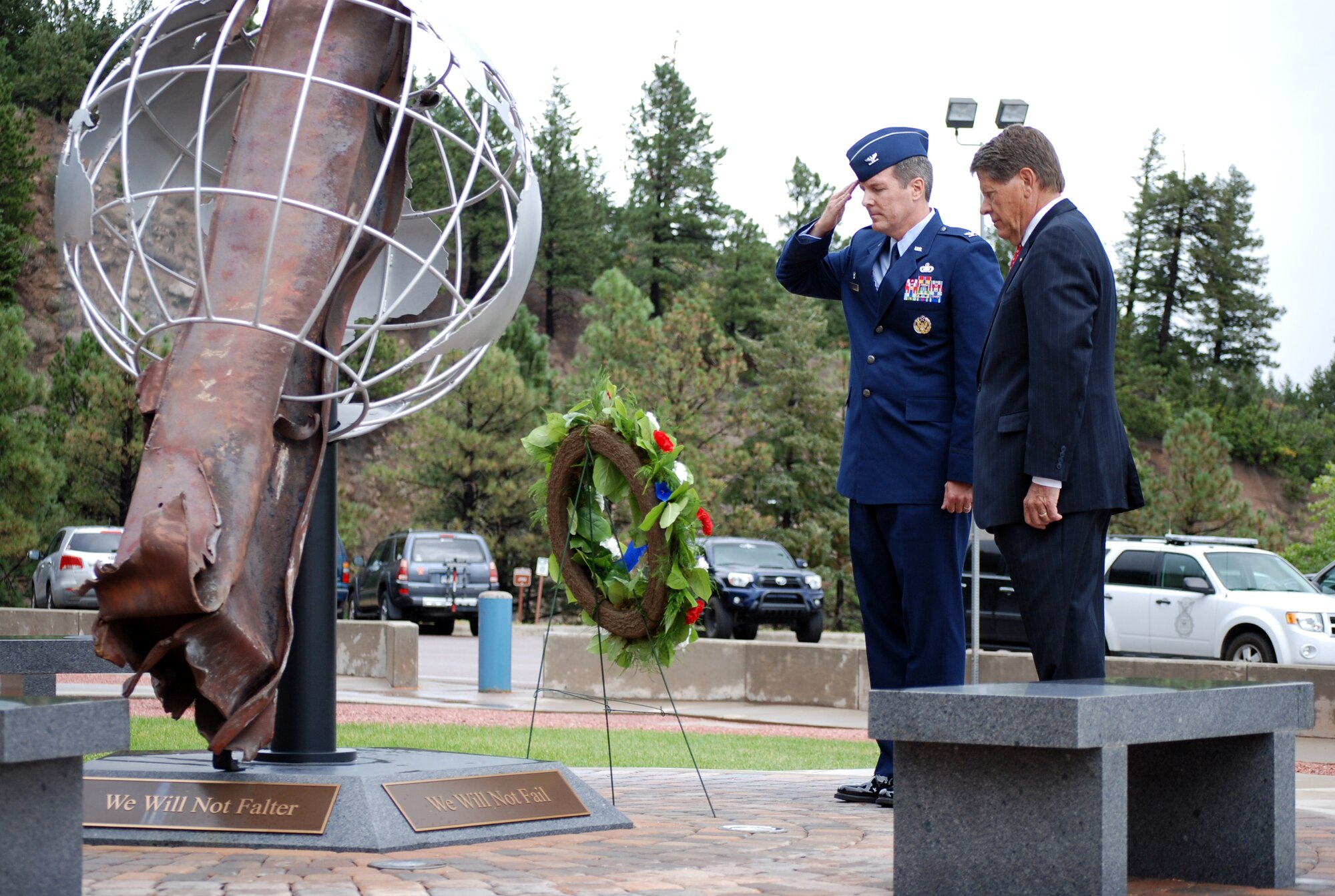 CHEYENNE MOUNTAIN AIR FORCE STATION, Colo. – Col. Travis Harsha, 721st Mission Support Group and CMAFS installation commander, and Don Addy, chairman of the Colorado Thirty Group, place a wreath at the CMAFS 9/11 memorial Sept. 11. The memorial is located near the CMAFS entry and honors the men and women who lost their lives in the attacks, during the rescue efforts, and in the defense of the country. (U.S. Air Force photo/Michael Golembesky)