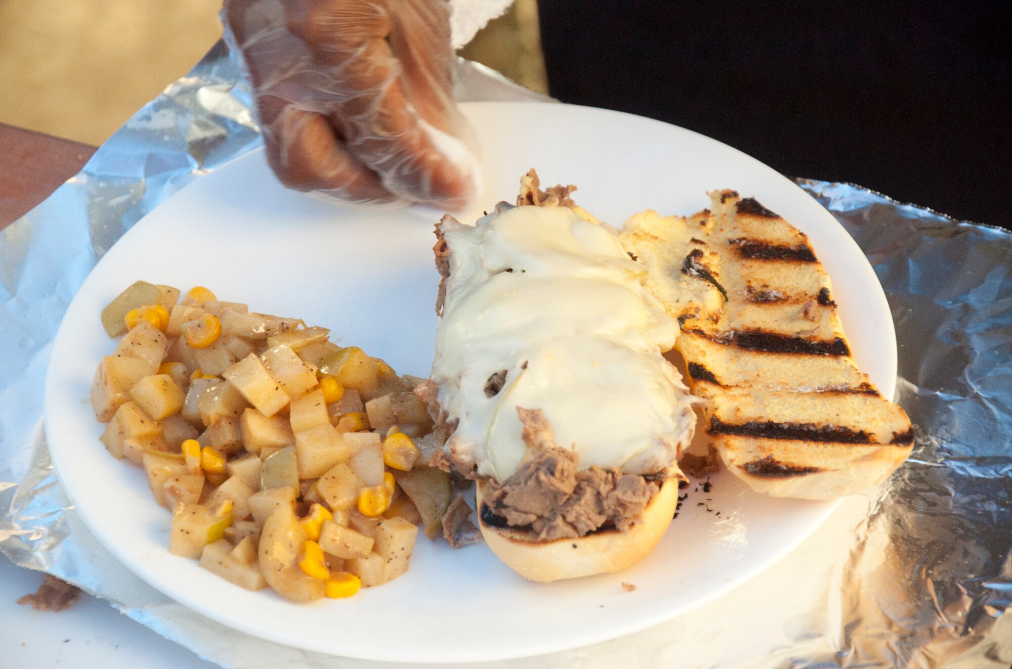 130913-F-GZ967-014 The missile chefs of the 319th Missile Squadron put the finishing touches on their version of a Philly-cheese steak sandwich during an F.E. Warren Air Force Base, Wyo., missile top chef competition Sept. 13, 2013. (U.S. Air Force photo by Airman 1st Class Brandon Valle)