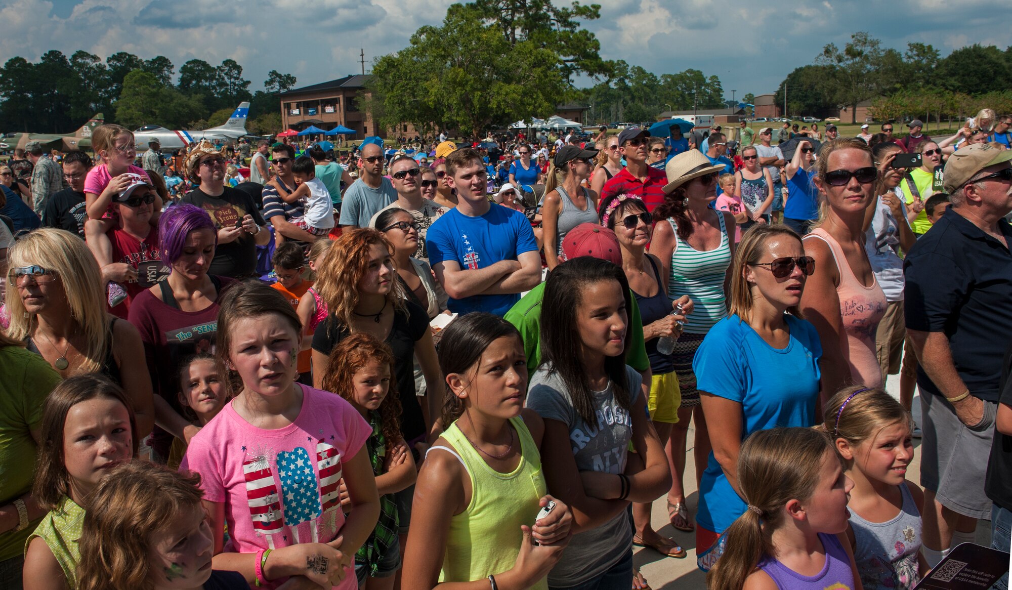 Airmen and family members watch a performance by  the Lt. Dan Band at Moody Air Force Base, Ga., Sept. 15, 2013. The band performed for two hours, featuring songs all ages could enjoy. (U.S. Air Force photo by Airman Alexis Grotz/Released)