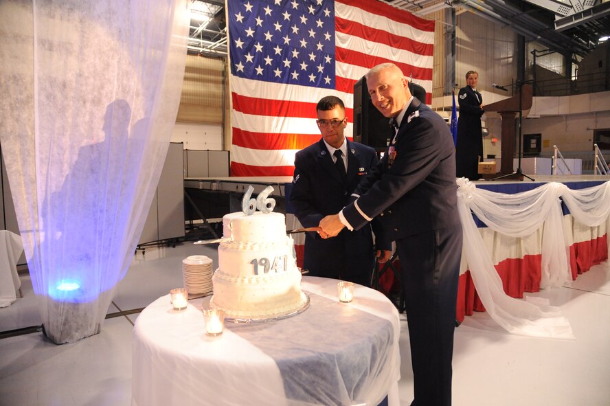 Airman 1st Class Hugo Degan, 319th Force Support Squadron food service apprentice, and Col. Paul Bauman, 319th Air Base Wing commander, cut the 2013 Air Force Ball cake on Grand Forks Air Force Base, N.D. Base and community members gathered to celebrate the 66th birthday of the Air Force. (U.S. Air Force photo/Airman 1st Class Zachiah A. Roberson) 