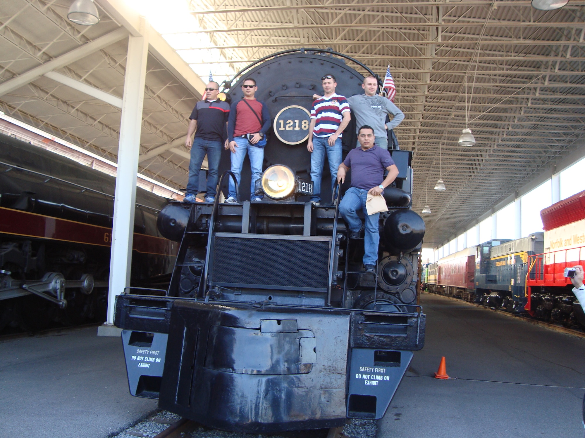 Foreign students pose in front of an old train at the U.S. Transportation Museum at Fort Eustis, Va., Nov. 10, 2012. Tours are one way the students learn about American culture during their stay at Fort Eustis. (U.S. Army courtesy photo)