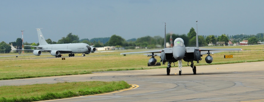 An F-15 from RAF Lakenheath taxis into its hardstand Sept. 13, 2013, as the first wave of jets fly into RAF Mildenhall, England. Approximately 10 F-15s are being temporarily housed here while runway repairs are completed at their home station. The normal quiet hours for RAF Mildenhall will apply to the F-15 aircraft, which means unless waivers are granted for specific occasions, there will be no F-15s flying weeknights between 11 p.m. and 6 a.m., and no flying during weekends between 6 p.m. Friday through 6 a.m. Monday. (U.S. Air Force photo by Karen Abeyasekere/Released)