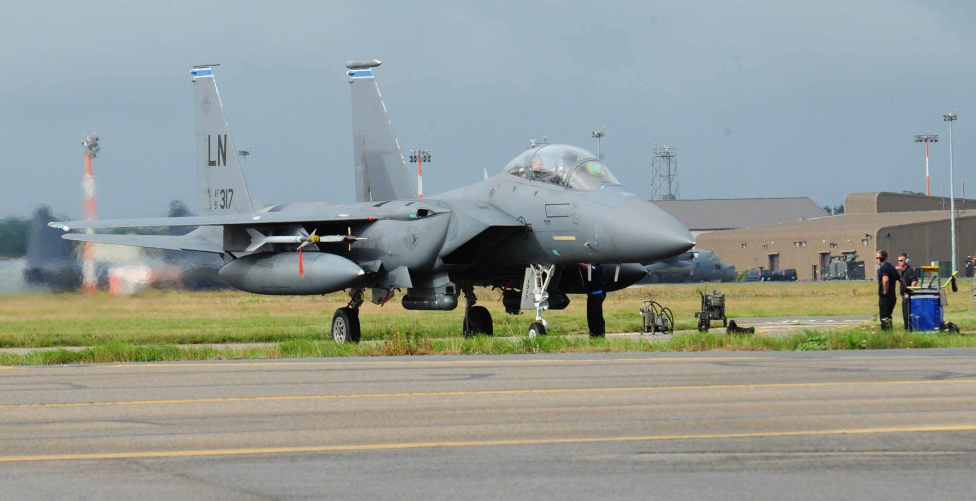 An RAF Lakenheath-based F-15 parks on a hardstand Sept. 13, 2013, as the first wave of jets fly into RAF Mildenhall, England. Approximately 10 F-15s are being temporarily housed here while runway repairs are completed at their home station. The normal quiet hours for RAF Mildenhall will apply to the F-15 aircraft, which means unless waivers are granted for specific occasions, there will be no F-15s flying weeknights between 11 p.m. and 6 a.m., and no flying during weekends between 6 p.m. Friday through 6 a.m. Monday. (U.S. Air Force photo by Karen Abeyasekere/Released)