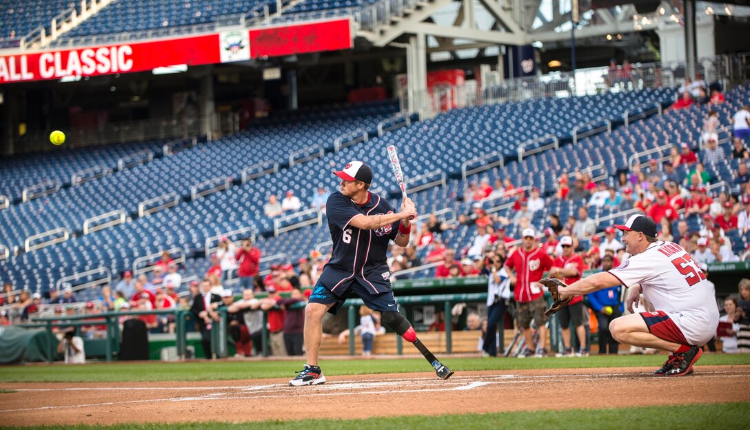 A wounded warrior stand ready to bat during the in the Wounded Warrior Celebrity Softball Classic hosted by the Washington Nationals baseball team in Washington, D.C., Sept. 15, 2013.