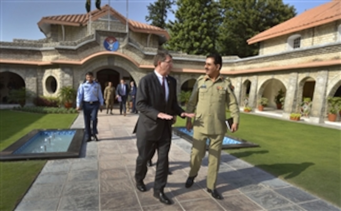 Pakistan’s Chairman of the Joint Chiefs of Staff Gen. Khalid Shameem, right, escorts Deputy Secretary of Defense Ashton B. Carter to his motorcade after their meeting in Islamabad, Pakistan, Sept. 16, 2013.  Carter is on a weeklong trip to Afghanistan, Pakistan and India to meet with senior leaders and troops deployed to the region.  