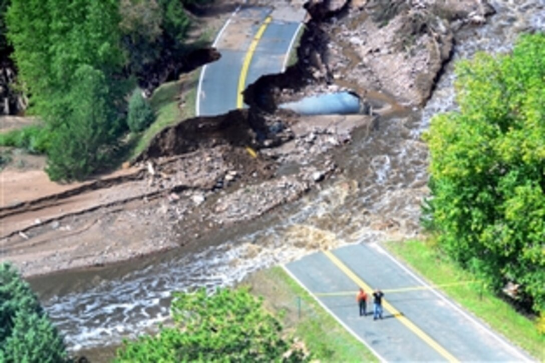 An aerial view shows damage to a road in Colorado due to flooding in the state, Sept. 16, 2013. Soldiers assigned to the 4th Infantry Division's 2nd General Support Aviation Battalion, 4th Combat Aviation Brigade, have been assisting with search and rescue operations in between Boulder, Colo., and Lyons, Colo.