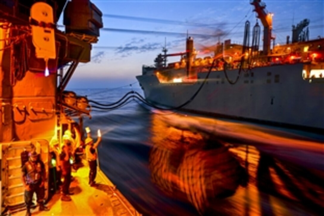 U.S. sailors assigned to the guided-missile cruiser USS Monterey conduct a replenishment with the Military Sealift Command dry cargo and ammunition ship USNS Alan Shepard in the U.S. 5th Fleet area of responsibility, Sept. 9, 2013. The Monterey is deployed to support maritime security operations and theater security cooperation efforts.