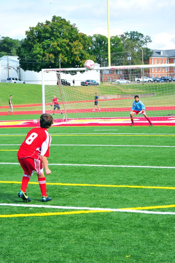 Broden, 12, kicks a practice ball at Noah, 13, before a middle school soccer game between Highland School, from Warrenton, and Quantico Middle/High School at Butler Stadium on Sept. 17, 2013. Quantico scored their first goal of the season during their second home game. 