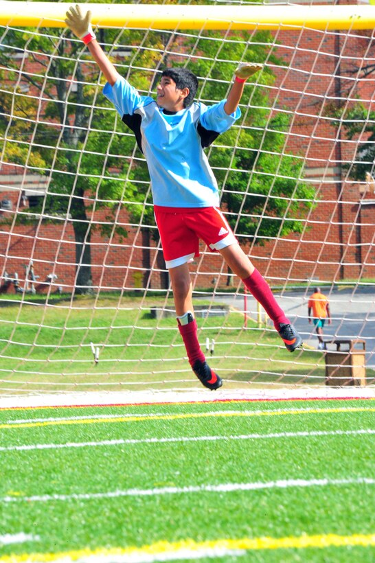 Noah, 13, blocks a ball, before a middle school soccer game between Highland School, from Warrenton, and Quantico Middle/High School at Butler Stadium on Sept. 17, 2013. Quantico scored their first goal of the season during their second home game.  