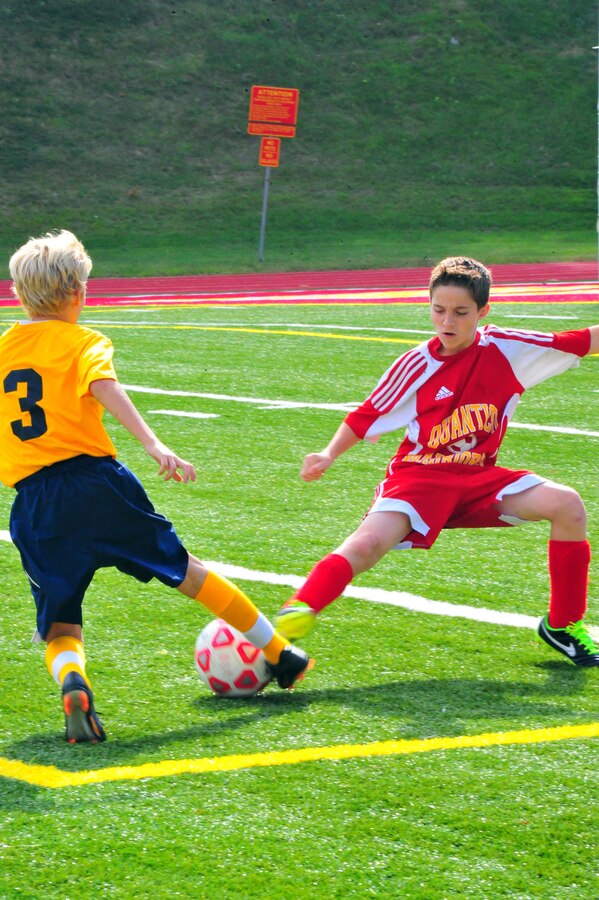Brice, 12, fights for a ball during a middle school soccer game between Highland School, from Warrenton, and Quantico Middle/High School at Butler Stadium on Sept. 17, 2013. Quantico scored their first goal of the season during their second home game. 