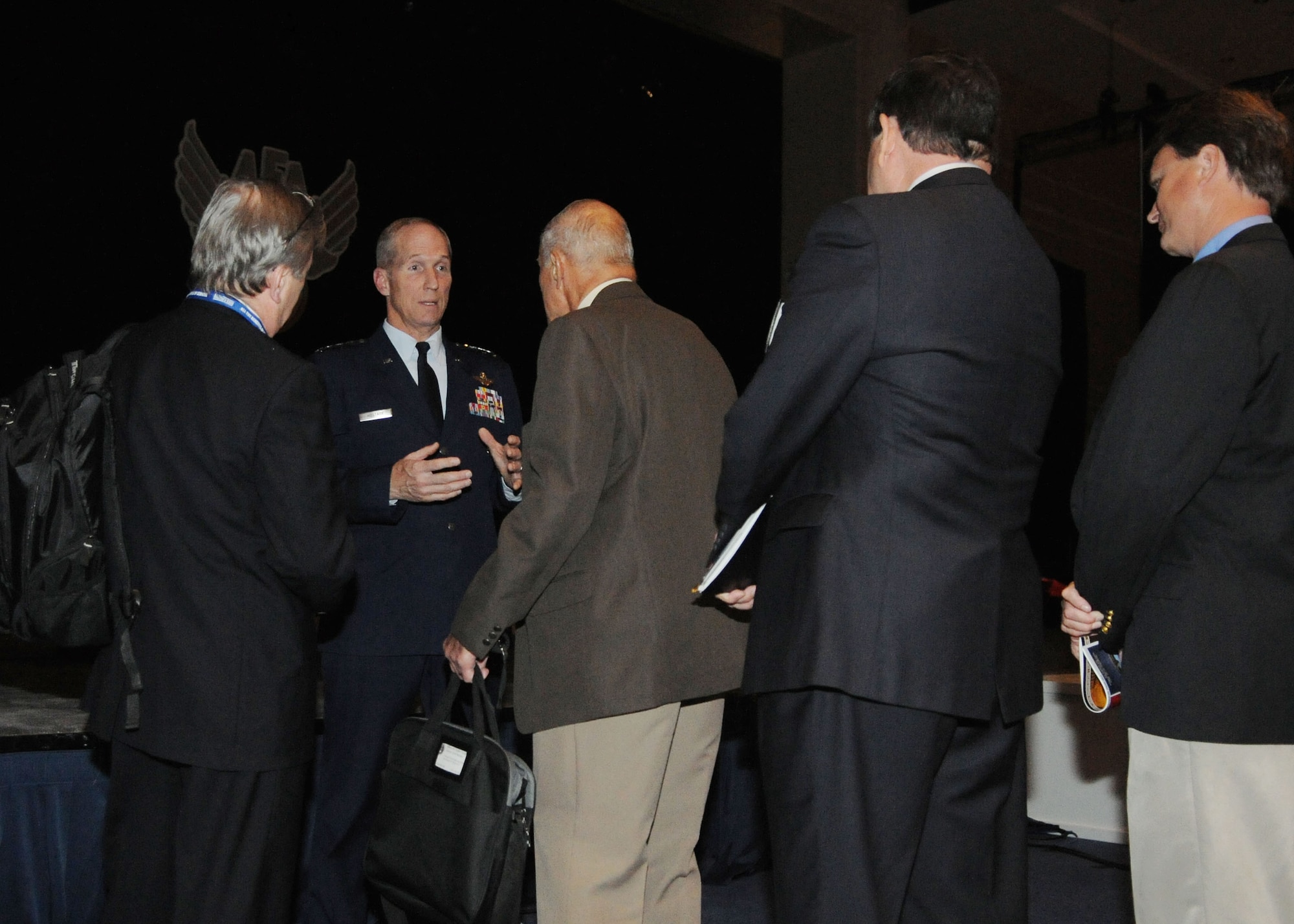 Gen. Mike Hostage socializes with attendees after delivering his “Combat Forces in the 2020’s” speech at the Air Force Association’s 2013 Air & Space Conference and Technology Exposition Sept. 17, 2013, in Washington, D.C. Hostage addressed where the service’s air combat forces aim to be in the future.  Hostage is the Air Combat Command commander. (U.S Air Force photo/Airman 1st Class Nesha Humes)
