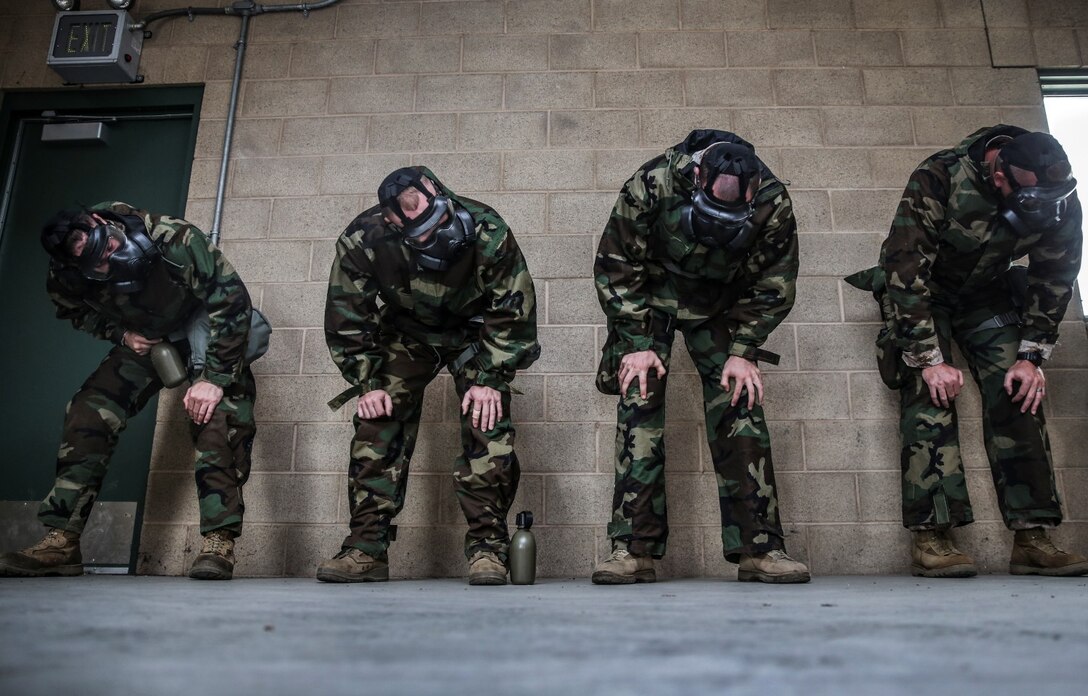 Marines with the 15th Marine Expeditionary Unit shake their heads vigorously to ensure they have properly fitted their M50 Joint Service General Purpose Mask during their unit’s chemical, biological, radiological and nuclear defense mask confidence training at Camp Margarita aboard Camp Pendleton, Calif., Sept. 17. (U.S. Marine Corps photo by Cpl. Emmanuel Ramos/Released)