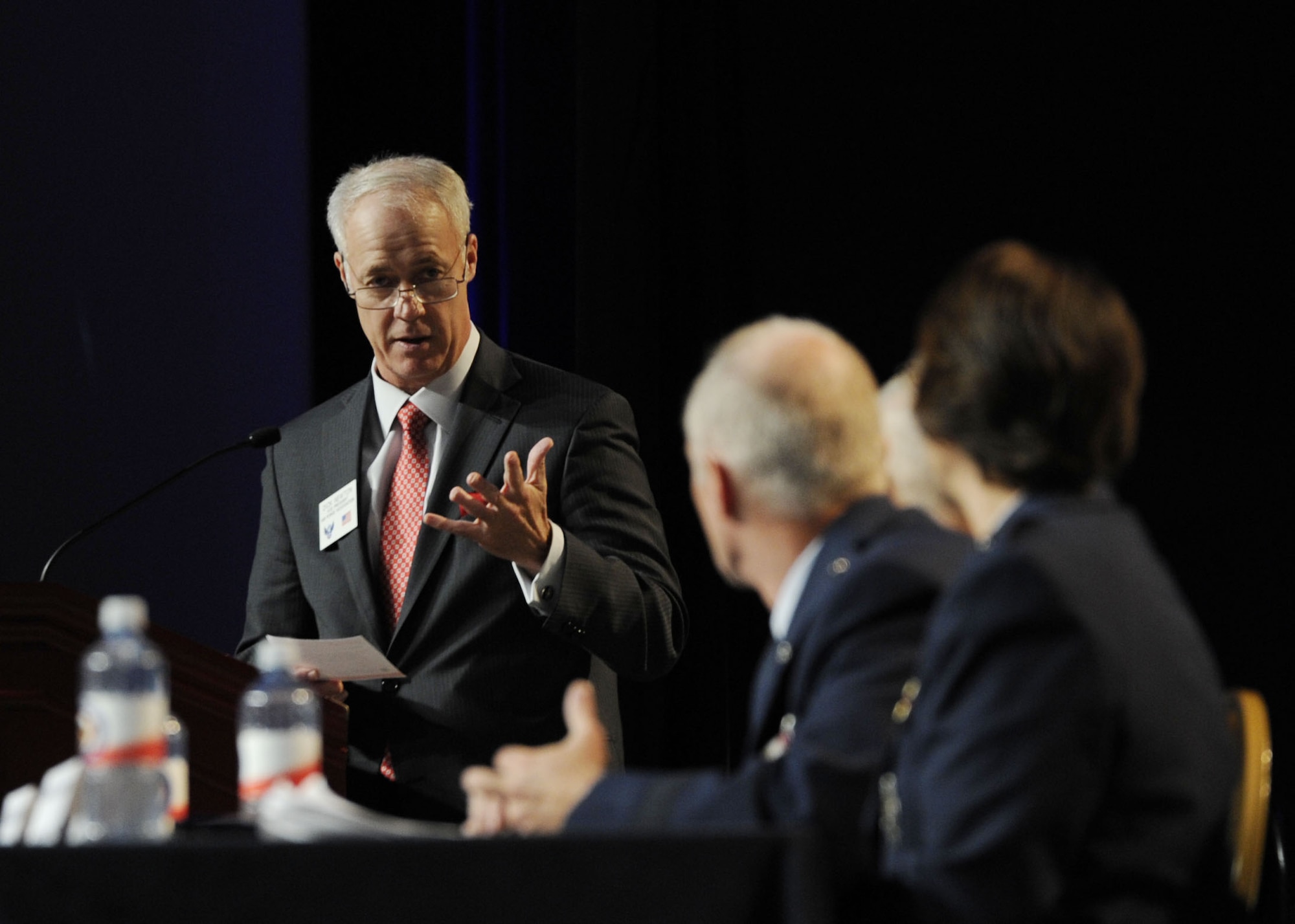 A moderator presents a question to Lt. Gen. James Kowalski, Maj. Gen. Garrett Harencak and Maj. Gen. Sandra Finan during the question and answer portion of the “Nuclear Enterprise Panel” Sept. 17, 2013, at the Air Force Association’s 2013 Air & Space Conference and Technology Exposition in Washington, D.C. (U.S Air Force Photo/Airman 1st Class Nesha Humes)