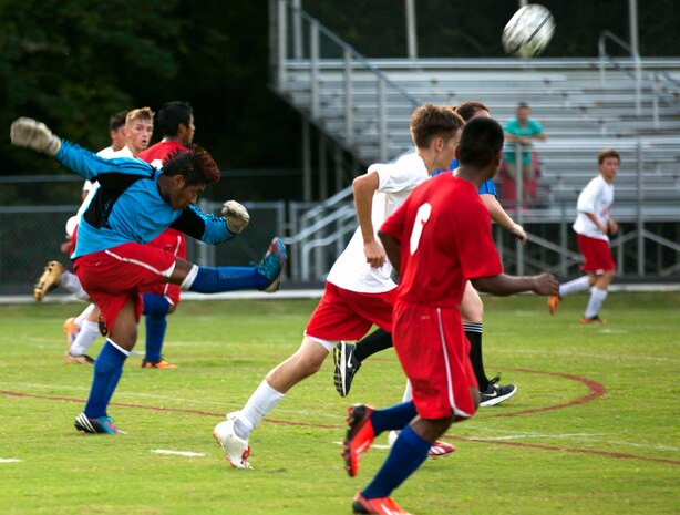 The Pender High School Patriot goalie kicks the ball away from the Lejeune Devilpups in an attempt to come back from behind in the match aboard Marine Corps Base Camp Lejeune, Sept. 12.