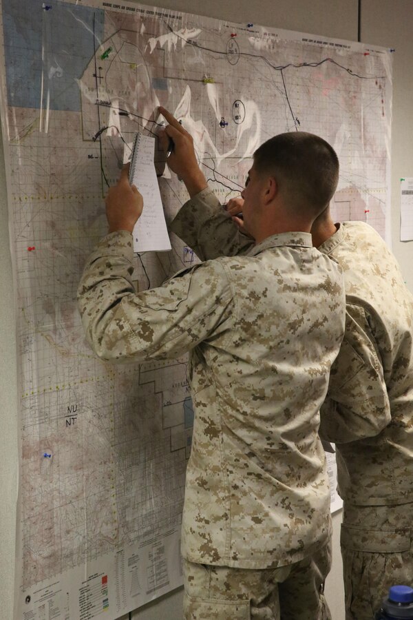 Corporal Nicholas B. Werner, an intelligence analyst with 6th Marine Regiment, 2nd Marine Division, and native of Troy, Pa, updates data on a map during a training command post exercise Sept. 18, 2013, inside the II Marine Expeditionary Force Simulation Center aboard Marine Corps Base Camp Lejeune. “Part of being a Marine is that you have to be ready, so as the headquarters element we have to be ready to react to anything that comes up,” said Maj. Kemper Jones, the operations officer with 6th Marines, from Richmond, Va. “It is part of our progressive training plan to make sure we are crawling, walking and then running in terms of our COC (command operation center) training.”