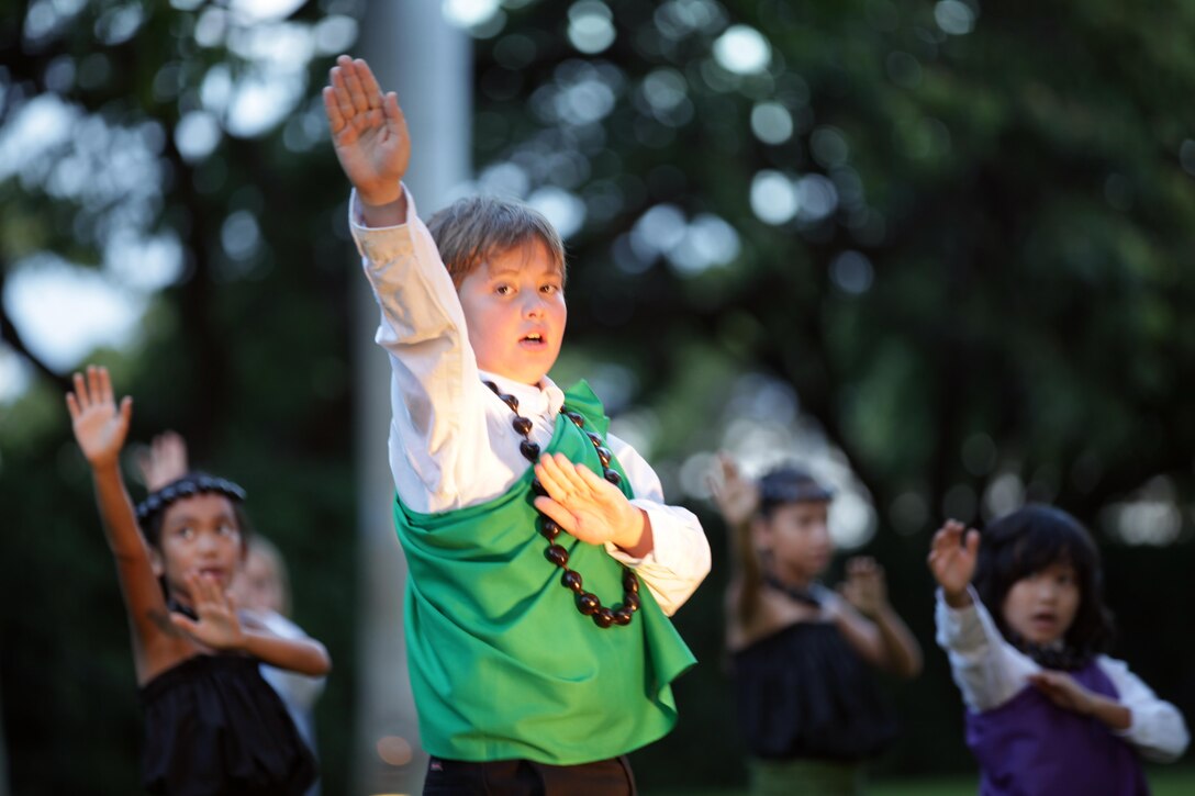 Students from Halau Ulumahiehie O’eo Kalani dance the ancient hula kahiko, during the centennial ceremony for the “Chesty Puller House” and neighboring homes, Sept. 15. Lt. Gen. Terry G. Robling, commander U.S. Marine Corps Forces, Pacific hosted a ceremony in honor of the centennial of the historic neighborhood.