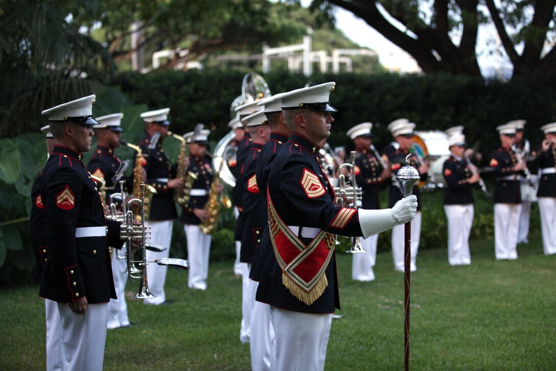 Gunnery Sgt. Brad Rehrig, Drum Major for the U.S. Marine Corps Forces, Pacific Band, stands in position during the centennial ceremony for the “Chesty Puller House” here, Sept. 15. Lt. Gen. Terry G. Robling, commander of MarForPac, and his wife, Cathe Robling, hosted the ceremony as a way to honor historic neighborhood.