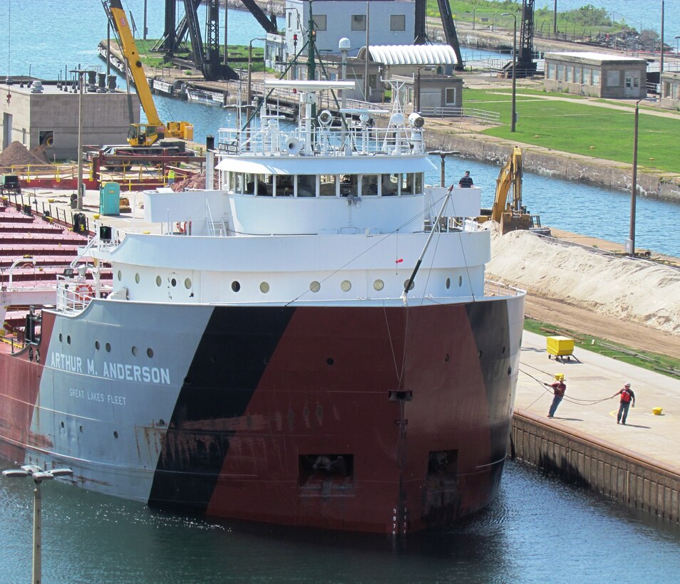 Linehandlers appear to be pulling the Arthur M. Anderson into position as it enters the Poe Lock June 10, 2013. The Anderson, like all Great Lakes vessels enters and exits the lock under its own power with its own captain and wheelman at the controls in the pilot house. The Anderson was on its way to Gary, Indiana with 25,672 net tons of iron ore.