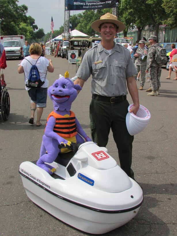 Brad Labadie, a park ranger from Eau Galle Recreation Area, near Spring Valley, Wis., escorted Seamoor the Water Safety Serpent around the fairgrounds during Military Appreciation Day at the Minnesota State Fair on August 27, 2013. Seamoor does a good job of getting everyone’s attention while Labadie talks about water safety and the importance of wearing your life jacket.