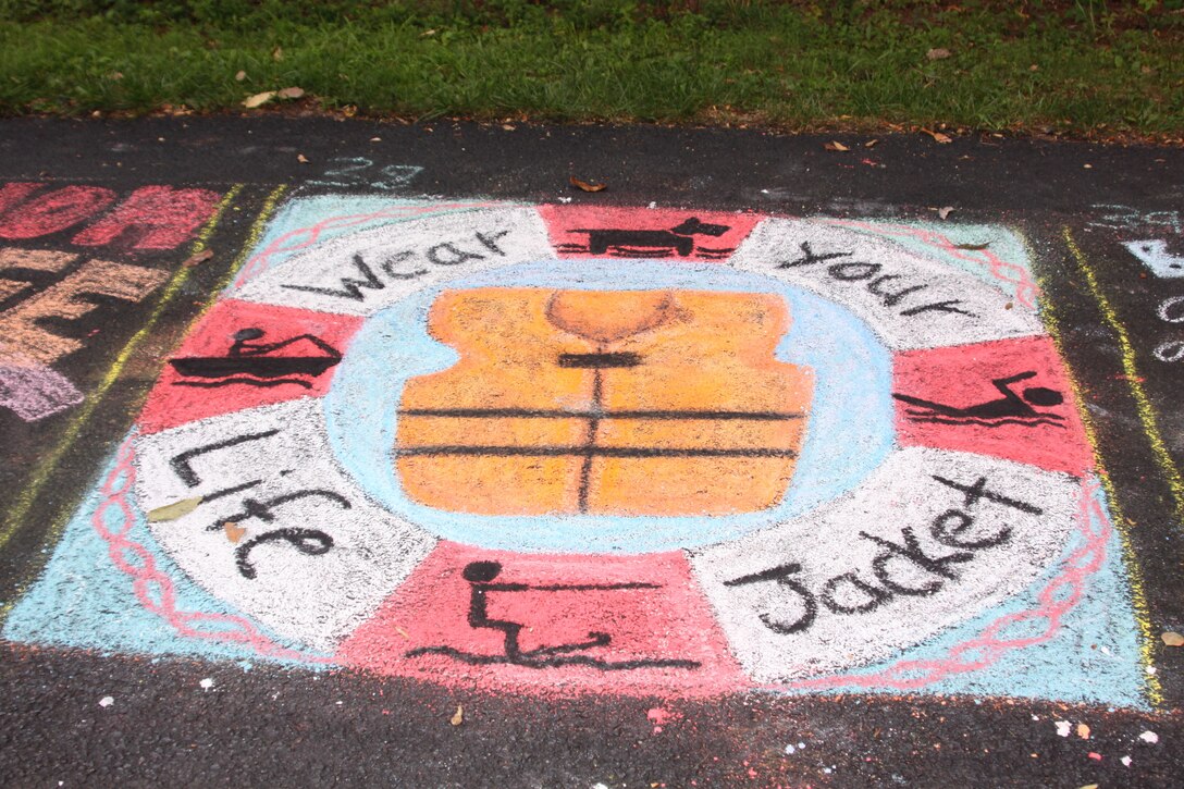 Alison Shope of Huntingdon, Pa., placed third in her age group for the masterpiece she created using only chalk to encourage visitors to wear life jackets during a variety of water activities at the lake and to also use one for their pets.