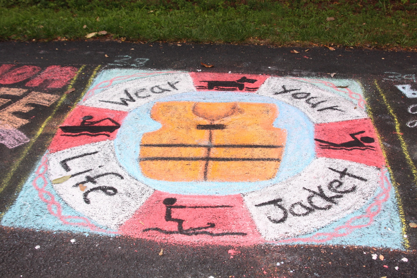 Alison Shope of Huntingdon, Pa., placed third in her age group for the masterpiece she created using only chalk to encourage visitors to wear life jackets during a variety of water activities at the lake and to also use one for their pets.