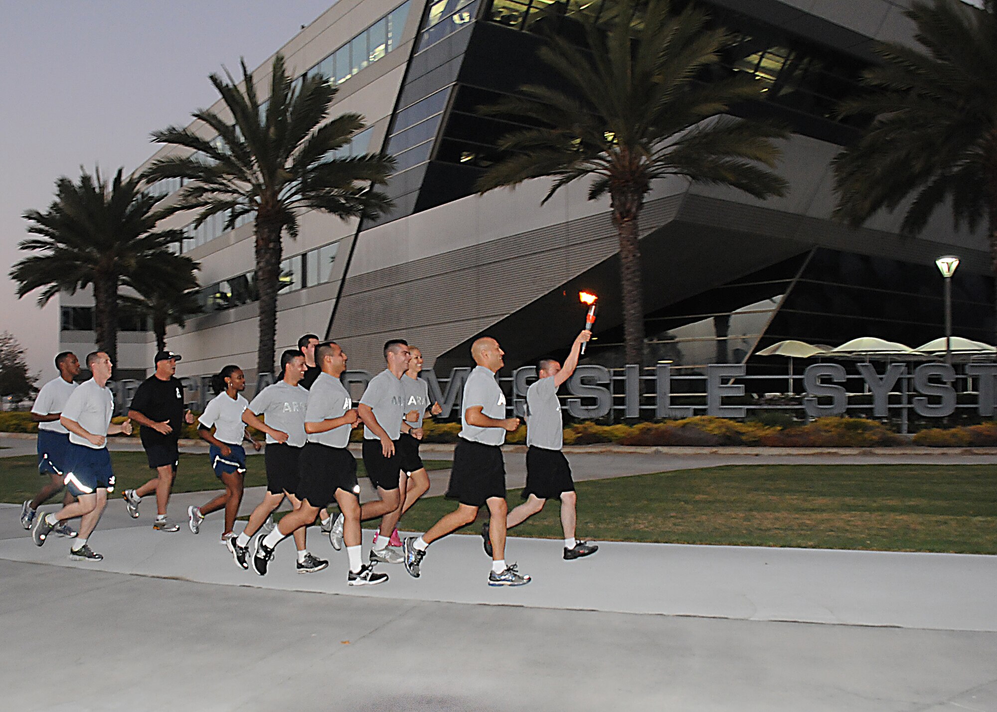 Runners begin the overnight run around the track, Sept. 18.  (Photo by Joe Juarez)
