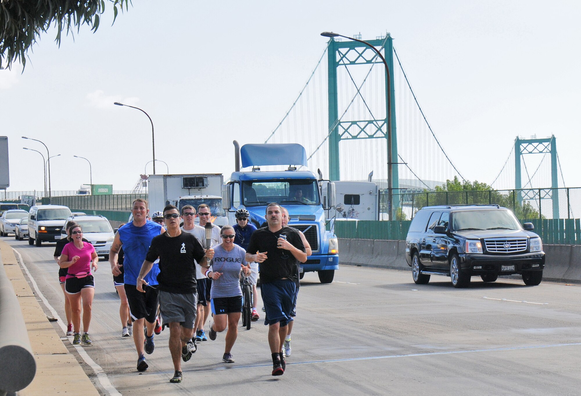 Runners cross the Vincent Thomas bridge during the 24-hour POW-MIA torch relay run, Sept. 18. The event sponsored by the Los Angeles Air Force Base Company Grade Officers Council began at Terminal Island Coast Guard Base, San Pedro and concludes 54 miles later at Los Angeles AFB in El Segundo. (Photo by Joe Juarez)