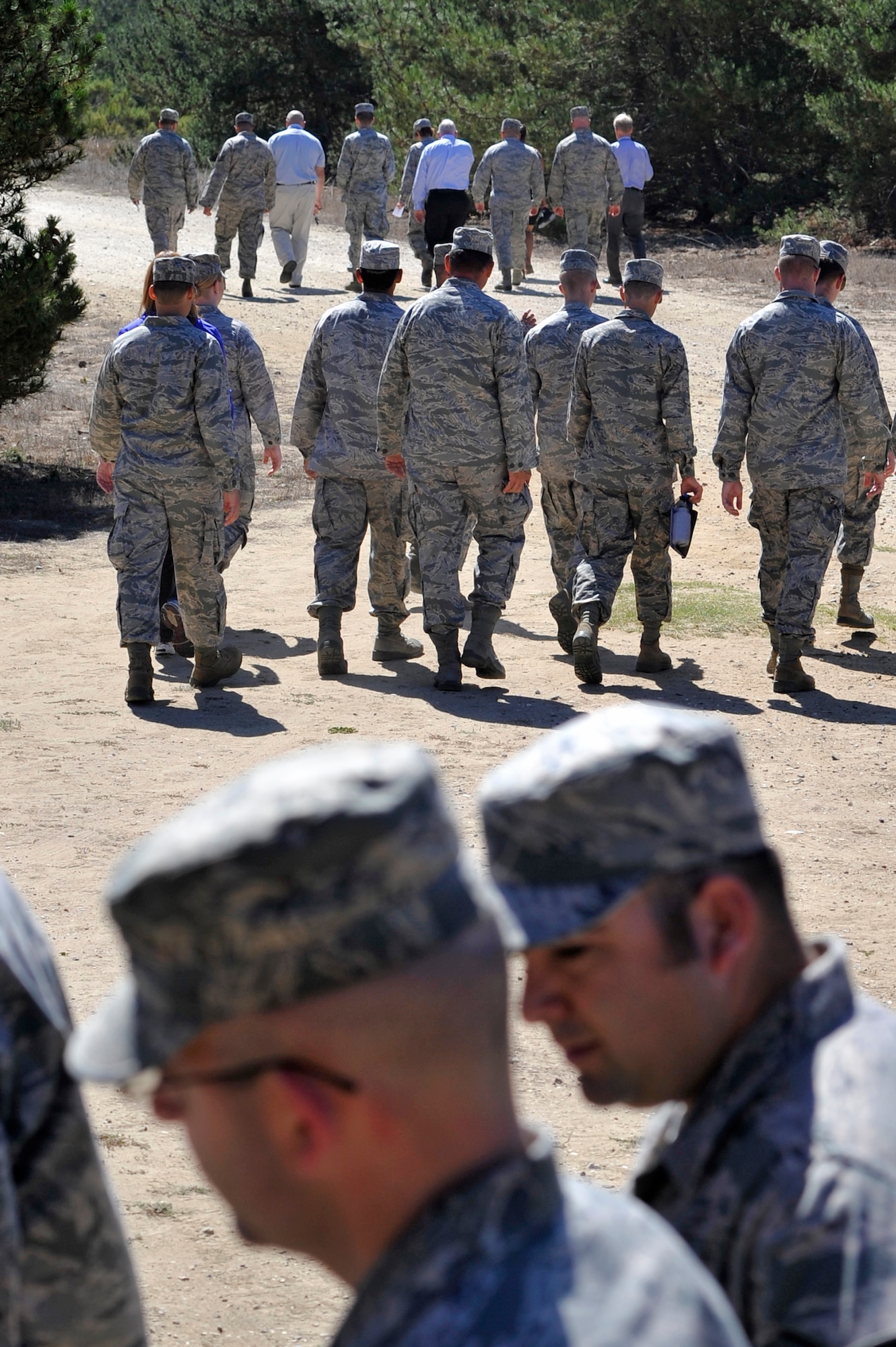 VANDENBERG AIR FORCE BASE, Calif. -- Teams walk towards the next banner signing station during the "Get R.E.A.L. Walk" here Tuesday, Sept. 17. During the walk, which was hosted by the 381st Training Group, Team V members were asked to change the culture and pledge their commitment to preventing sexual assaults by signing banners representing Respect, Equality, Accountability and Leadership. (U.S. Air Force photo/Michael Peterson)