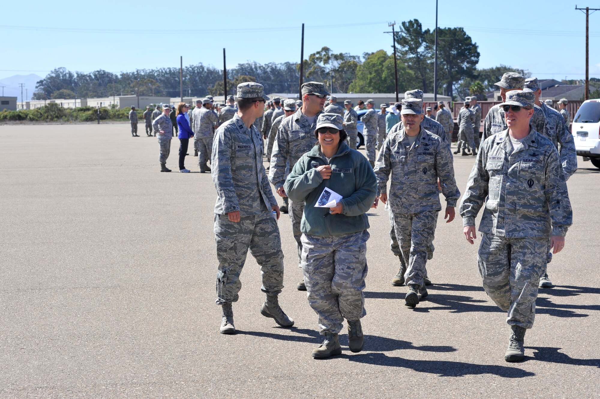 VANDENBERG AIR FORCE BASE, Calif. -- Col Shahnaz Punjani, 30th Launch Control Group commander, leads a team from the 30 LCG out of the parade grounds to begin the "Get R.E.A.L. Walk" route here Tuesday, Sept. 17. During the walk, which was hosted by the 381st Training Group, Team V members were asked to change the culture and pledge their commitment to preventing sexual assaults by signing banners representing Respect, Equality, Accountability and Leadership. (U.S. Air Force photo/Michael Peterson)