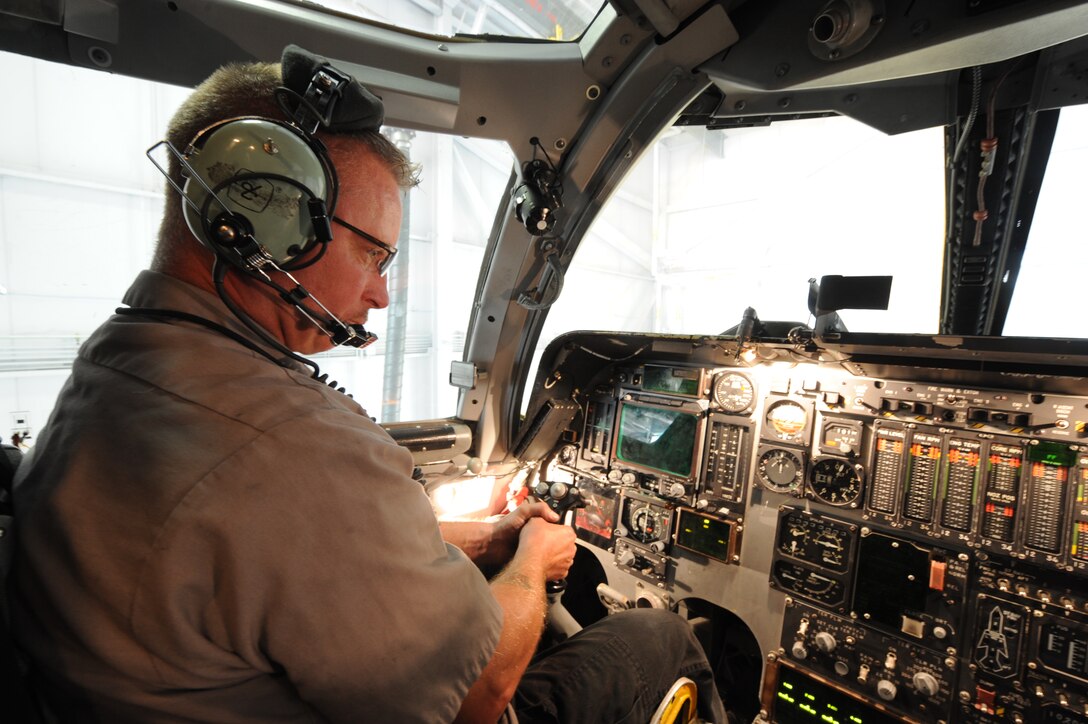 Derrick Brown, 28th Aircraft Maintenance Squadron contract field team engine mechanic, directs flight control inputs while performing an X-Y plot in a B-1 on Ellsworth Air Force Base, S.D., Sept. 11, 2013. With 27 aircraft to maintain, the CFT shop is a centralized unit with specialists from various career fields who play a vital role in expediting the maintenance process. (U.S. Air Force photo by Airman 1st Class Rebecca Imwalle/Released) 