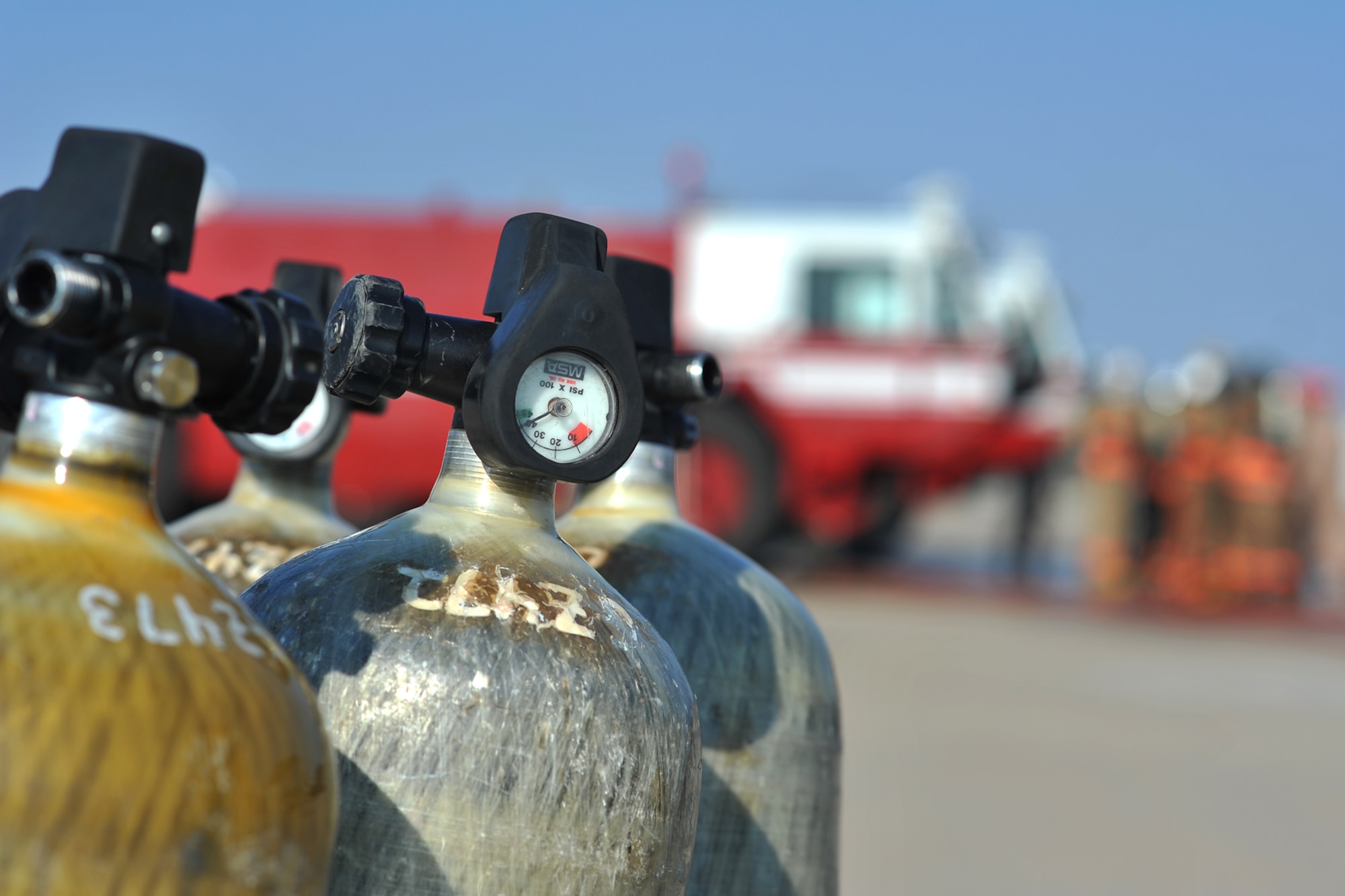 GOODFELLOW AIR FORCE BASE, Texas - Air tanks sit outside the training area at the Louis F. Garland Department of Defense Fire Academy Sept. 6. The air tank is an essential piece of bunker gear; it delivers a limited supply of air to the firefighter. (U.S. Air Force/ Senior Airman Michael Smith)