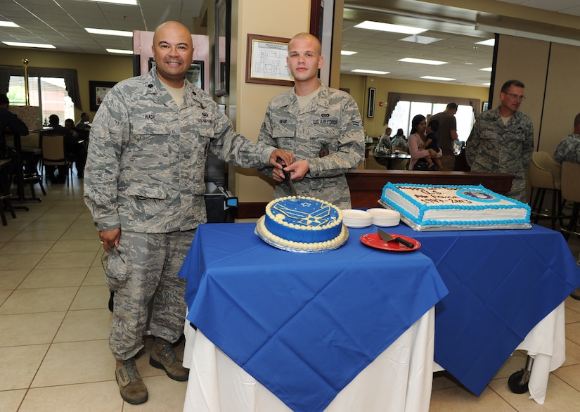 To celebrate the Air Force’s 66th birthday U.S. Air Force Lt. Col. William Wade, Joint Task Force-Bravo deputy commander, and one of 612th Air Base Squadron's junior Airmen, Airman 1st Class Chad Behr, 612th ABS crew chief, cut the Air Force cake here Sept 18, 2013. Initially part of the U.S. Army Air Corps, the now U.S. Air Force, was made into its own military branch on Sept 18, 1947 under the National Security Act of 1947. The U.S. Air Force is one of the strongest and most technologically advanced forces on the planet.   