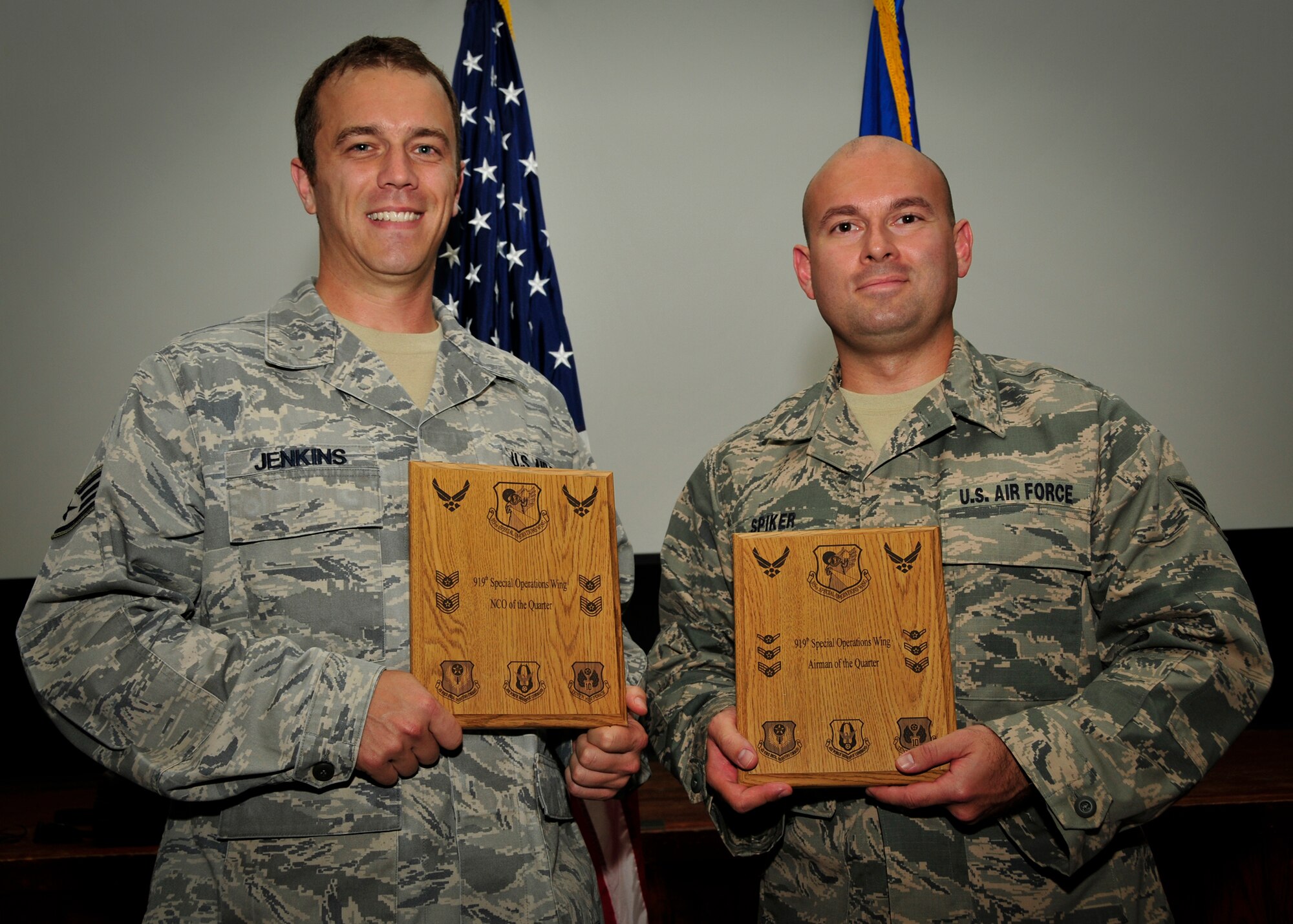 Air Force Reservists Staff Sgt. Zechariah Jenkins and Senior Airman Daniel Spiker Jr, from the 919th Logistics Readiness Squadron, pose with their 919th Special Operations WIng Quarterly Awards Sept. 8 at Duke Field, Fla.  Jenkins and Spiker earned honors as the wing's NCO and Airman of the Quarter, respectively.  Two other awardees, from the 919th Force Support Squadron, were unavailable for photo: Capt. Kelli Rabideau, Company Grade Officer of the Quarter, and Master Sgt. Todd Haney, Senior NCO of the Quarter. (U.S. Air Force photo/Tech. Sgt. Jasmin Taylor)