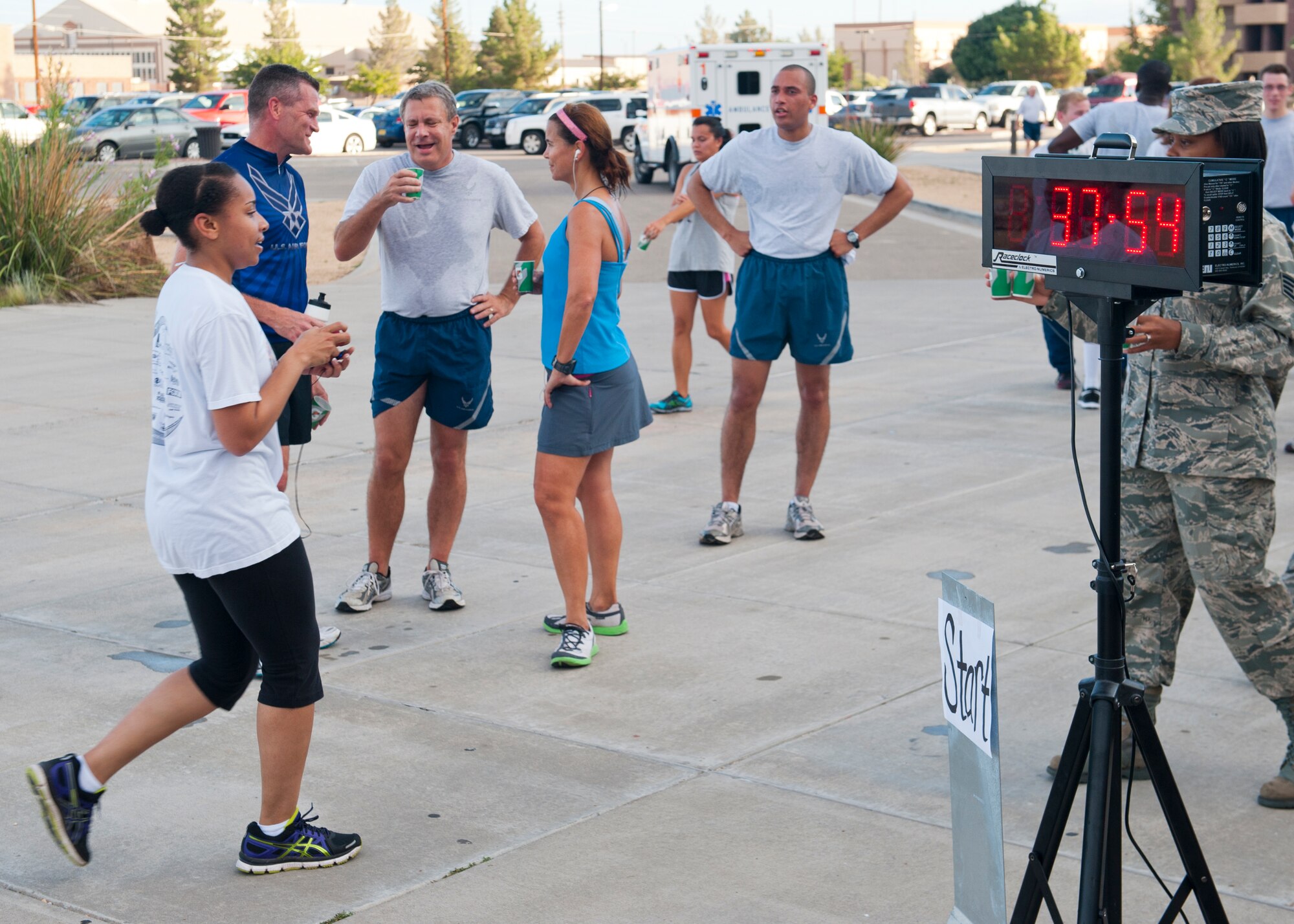 Members of Team Holloman complete the 5K Air Force Birthday Run, sponsored by the Domenici Fitness Center, to celebrate the 66th anniversary of the United States Air Force at Holloman Air Force Base, N.M., Sept. 18. With the implementation of the National Security Act of 1947, the Department of the Air Force was established independently on Sept. 18th. (U.S. Air Force photo by Airman 1st Class Daniel E. Liddicoet/Released) 