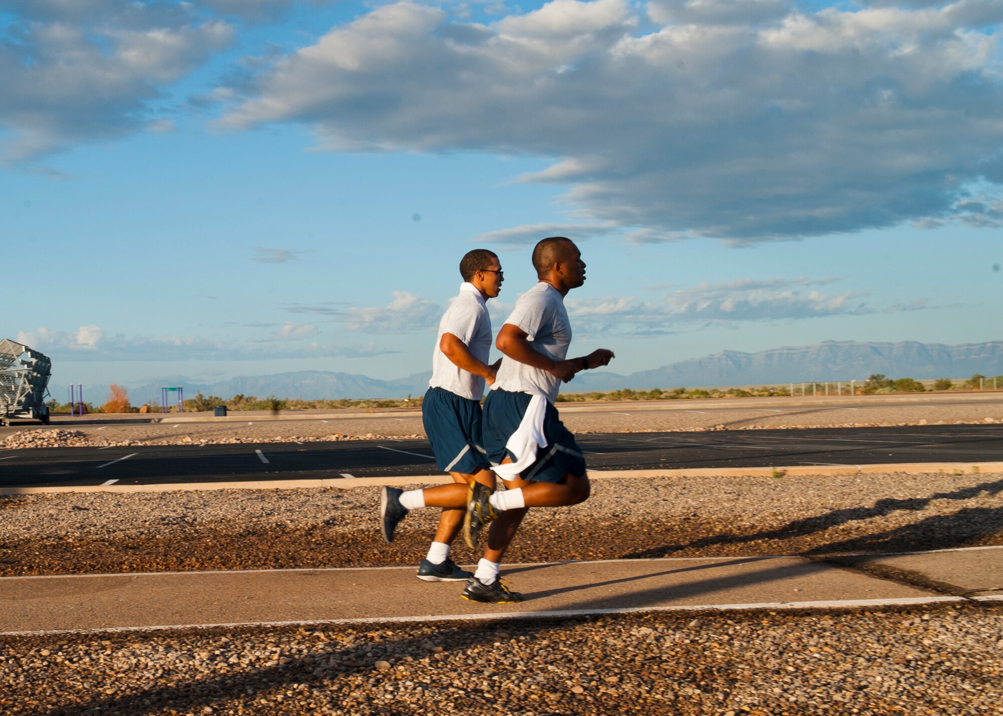Members of Team Holloman participate in the 5K Air Force Birthday Run, sponsored by the Domenici Fitness Center, to celebrate the 66th anniversary of the United States Air Force at Holloman Air Force Base, N.M., Sept. 18. With the implementation of the National Security Act of 1947, the Department of the Air Force was established independently on Sept. 18th. (U.S. Air Force photo by Airman 1st Class Daniel E. Liddicoet/Released) 