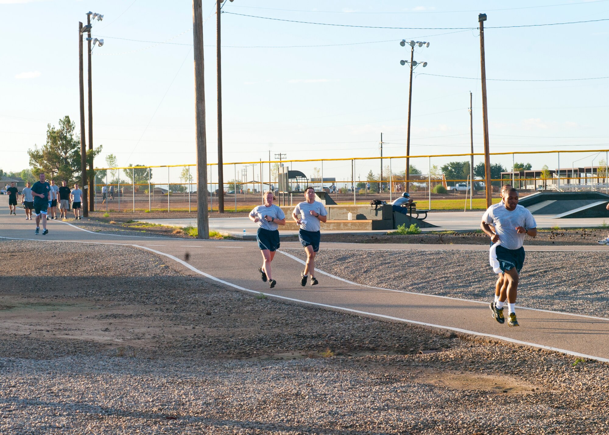 Members of Team Holloman participate in the 5K Air Force Birthday Run, sponsored by the Domenici Fitness Center, to celebrate the 66th anniversary of the United States Air Force at Holloman Air Force Base, N.M., Sept. 18. With the implementation of the National Security Act of 1947, the Department of the Air Force was established independently on Sept. 18th. (U.S. Air Force photo by Airman 1st Class Daniel E. Liddicoet/Released) 