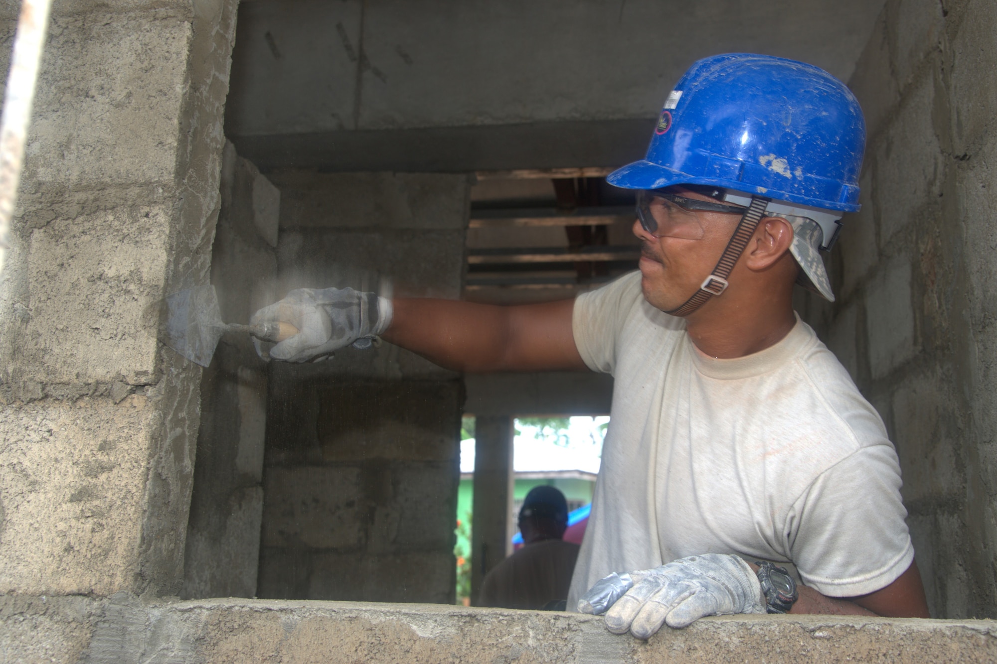 TSgt Donald Sicat, 18th Civil Engineer structural craftsman, applies mortar
to a window frame Sept. 13, 2013, at Virgilio R. Magbanua Memorial Elementary
School, Puerto Princesa, Philippines. Sicat works with Airmen from Kadena Air Base, Japan, along with U.S. Navy, and Philippine Air Force counterparts supporting Pacific Unity 2013-7. Pacific Unity is a bilateral Engineering Civic Action Program (ENCAP) conducted in the Asia-Pacific region in collaboration with host nation civil authorities and military personnel. (U.S. Air Force photo/Master Sgt. Ryan Kruse)
