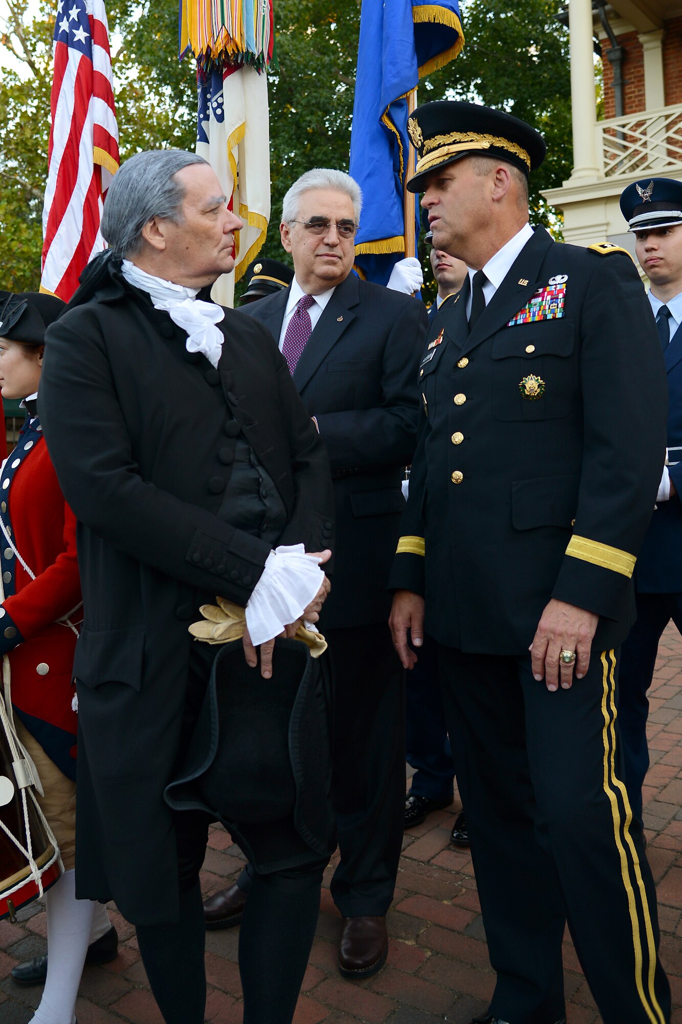 U.S. Army Lt. Gen. David D. Halverson, Training and Doctrine Command deputy commanding general, and Ron Carnegie, a Colonial Williamsburg actor performing as George Washington, meet before the Constitution Day Concert in Williamsburg, Va., Sept. 17, 2013. The event featured a combined ensemble of the TRADOC Band and U.S. Air Force Heritage of America Band. (U.S. Air Force photo by Airman 1st Class Victoria H. Taylor/ Released)