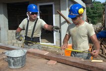 Staff Sgt. Robert Frazier, left, and Senior Airman Richard Gere measure
trusses Sept. 11, 2013, at the Virgilio R. Magbanua Memorial Elementary
School, Puerto Princesa, Philippines. The 18th Civil Engineer
Airmen are from Kadena Air Base, Japan and are joined with U.S. Navy and Philippine Air Force counterparts supporting Pacific Unity 2013-7 by building two new classrooms for the school. Pacific Unity is a bilateral Engineering Civic Action Program (ENCAP) conducted in the Asia-Pacific region in collaboration with host nation civil authorities and military personnel. (U.S. Air Force photo/Master Sgt. Ryan Kruse)
