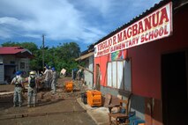 Airmen from the 18th Civil Engineer Group prepare for their next project
Sept. 11, 2013, at the Virgilio R. Magbanua Memorial Elementary School,
Puerto Princesa, Philippines. The Airmen, from Kadena Air Base, Japan, are joining U.S. Navy and Philippine Air Force counterparts in supporting Pacific Unity 2013-7 by
building two new classrooms for the school. Pacific Unity is a bilateral
Engineering Civic Action Program (ENCAP) conducted in the Asia-Pacific
region in collaboration with host nation civil authorities and military personnel. (U.S. Air Force photo/Master Sgt. Ryan Kruse)
