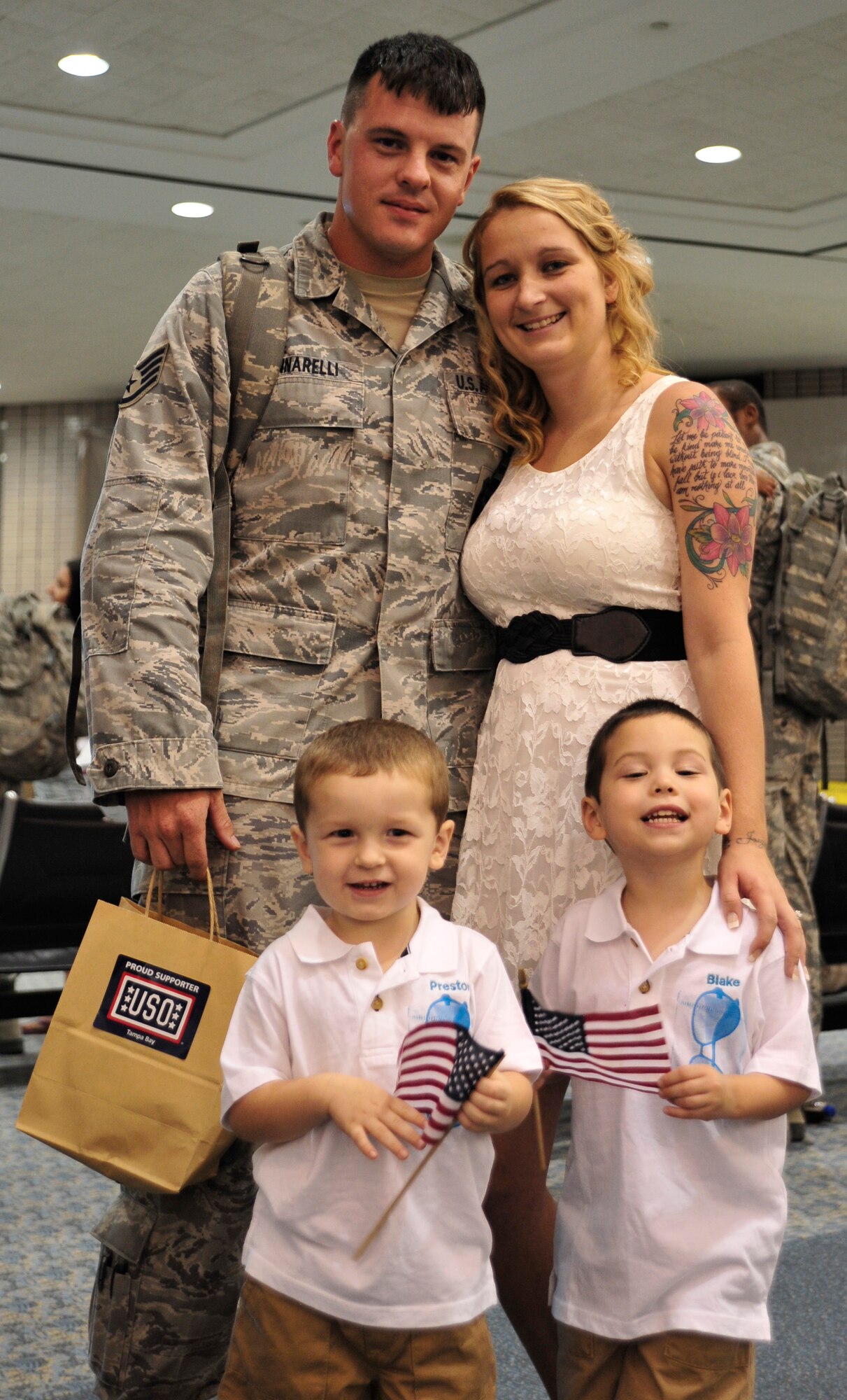 Staff Sgt. Daniel Iannarelli, 6th Security Forces Squadron, greets his family after returning from his third and most recent deployment Sept. 6, 2013 at Tampa International Airport. Iannarelli gained valuable experience through this deployment and met people from across the Air Force. (U.S. Air Force photo by Airman 1st Class Sarah R. Hall-Kirchner/Released)