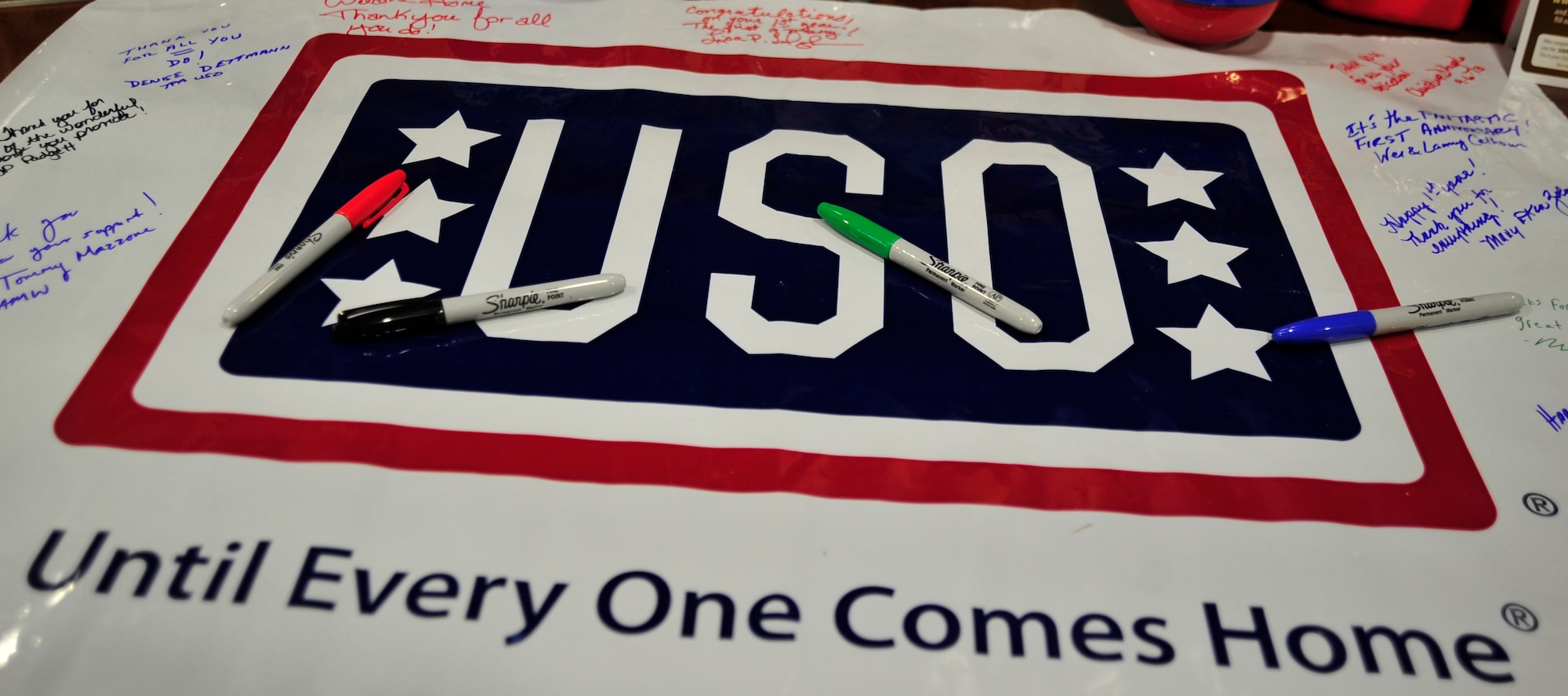 The USO Tampa Bay Welcome Center along with a crowd of supporters celebrated its anniversary Sept. 6, 2013 at the Tampa International Airport. The mission of the welcome center is to be a “home away from home” for military members and their families as they travel “until every one comes home.” (U.S. Air Force photo by Airman 1st Class Sarah R. Hall-Kirchner/Released)