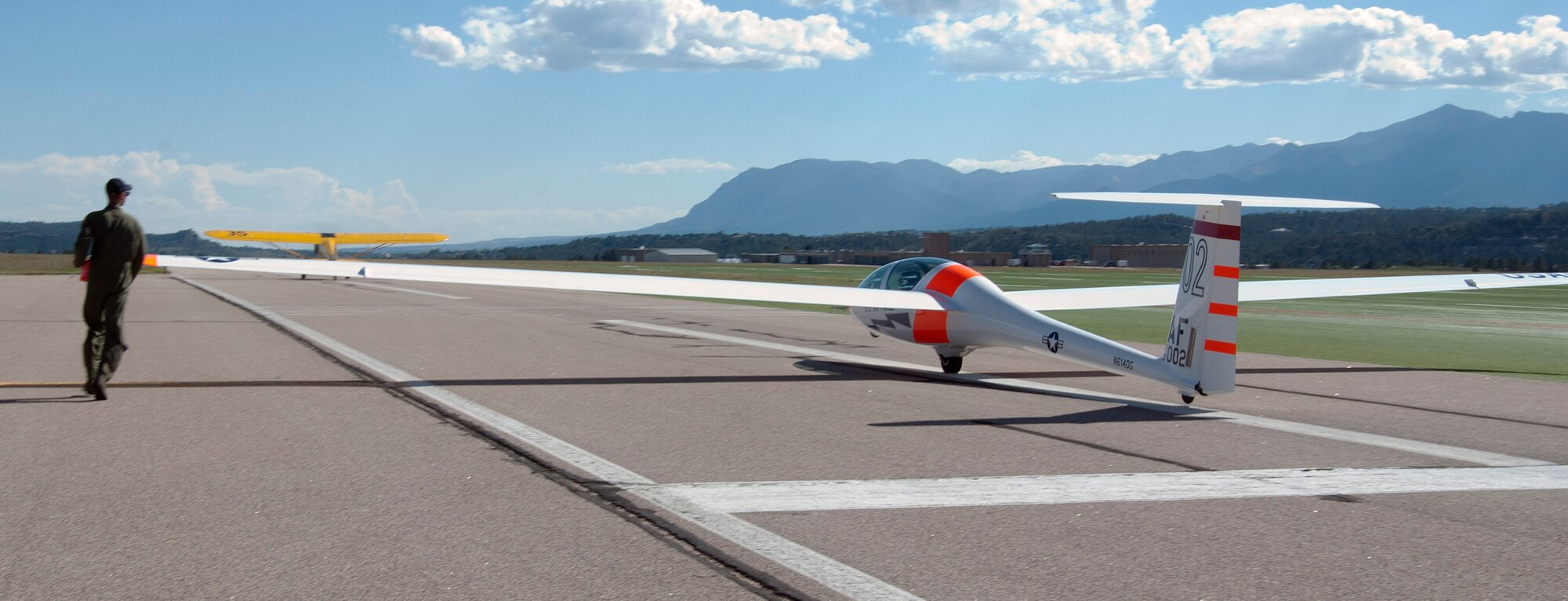 Adam Marcinkowski takes off on his first solo flight in a TG-16A glider at the Air Force Academy Airfield Sept. 17, 2013. A cadet's first solo flight typically consists of flying a simple pattern after releasing the tow cable and landing on the artificial turf surface. Marcinkowski is assigned to Cadet Squadron 30. (U.S. Air Force photo/Don Branum)