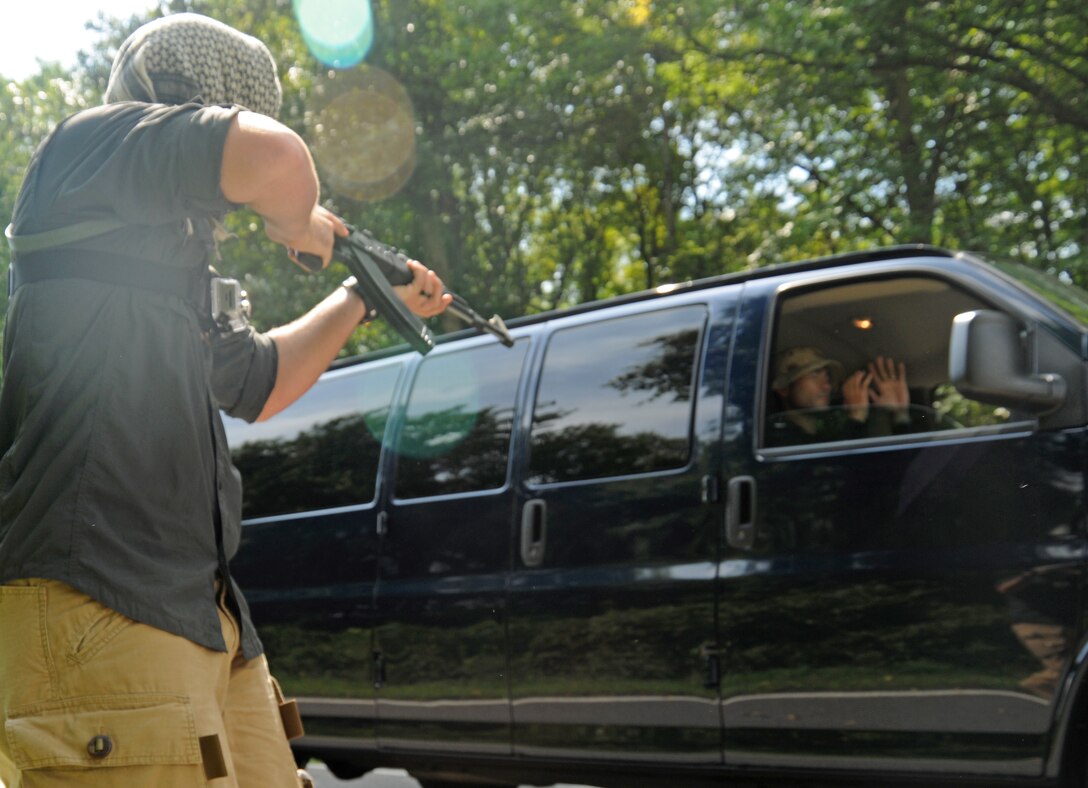 An Airman from Joint Base Andrews hijacks a vehicle during a training exercise at Davidsonville Communications Site, Md., Aug. 21, 2013. The exercise was designed to teach survival techniques in the event of an aircraft mishap. (U.S. Air Force photo/Airman 1st Class Erin O’Shea)