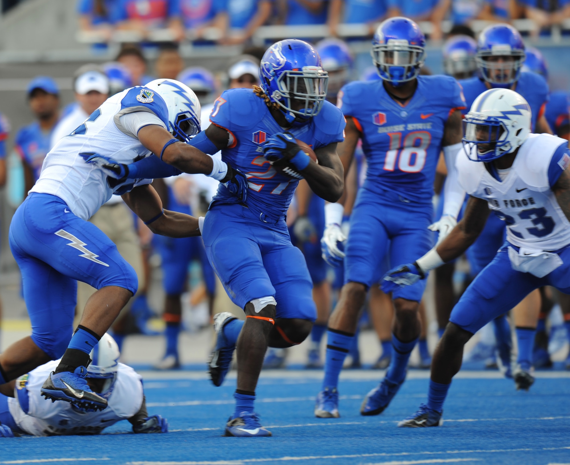 Boise State University running back Jay Ajayi twists and turns to avoid tackles during the BSU versus Air Force Academy college football game Sept. 13, 2013, at Bronco Stadium in Boise, Idaho. The Broncos offense totaled 533 yards and went 8 of 10 on third downs to earn their second straight victory. (U.S. Air Force photo by Senior Airman Benjamin Sutton/Released)