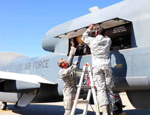 Senior Airman Cameron Guy (left), 12th Aircraft Maintenance Unit RQ-4 crew chief, and Tech. Sgt. Shareem Jones, 12th Aircraft Maintenance Unit flightline expediter, perform an engine inspection for a RQ-4 Global Hawk prior to launch Sept. 17, 2013, at Beale Air Force Base, Calif. The Northrop Grumman Corp. announced the aircraft achieved 100,000 flight hours Sept. 5. (U.S. Air Force photo by Airman 1st Class Bobby Cummings/Released)