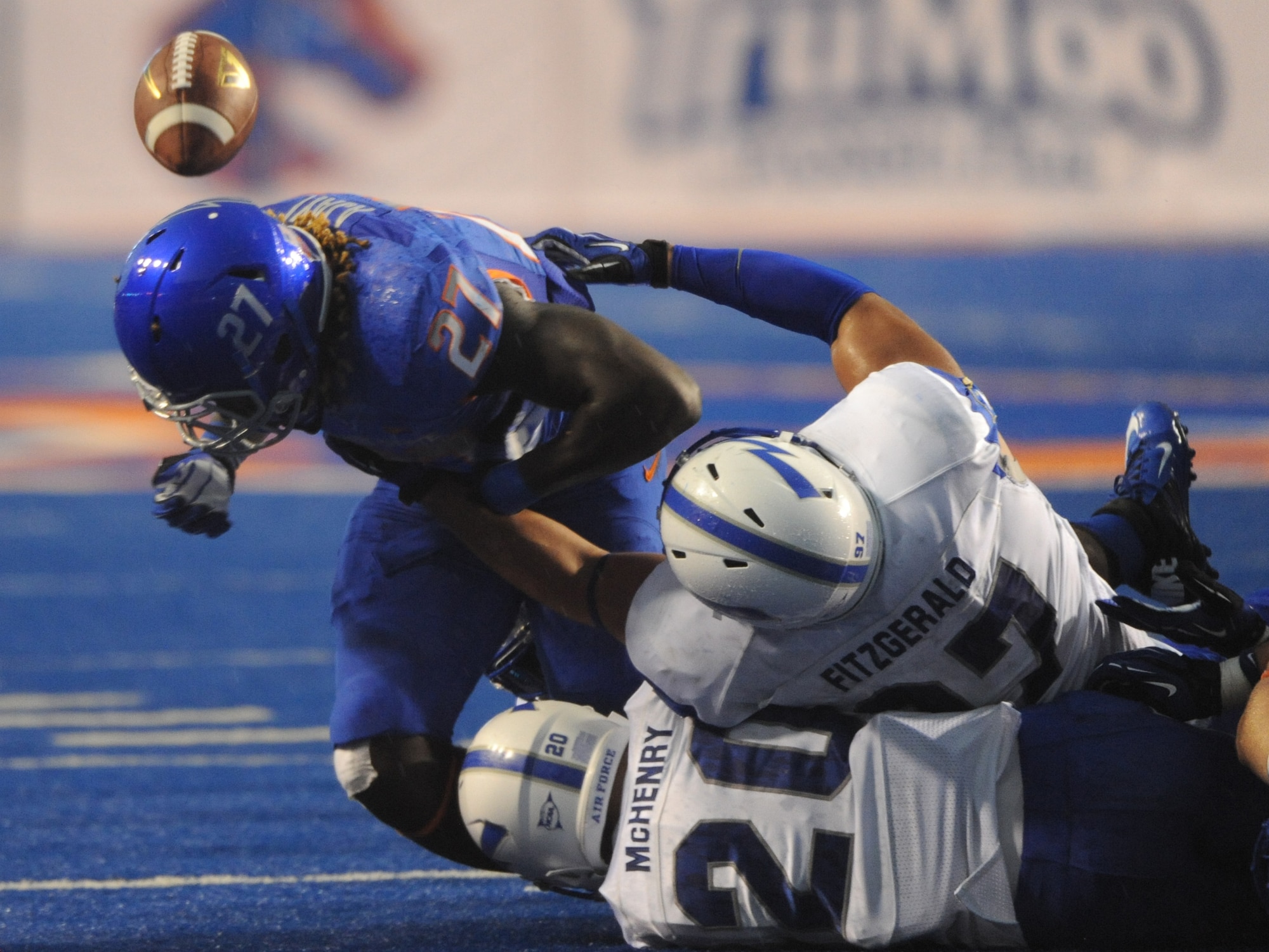 Boise State Broncos running back Jay Ajayi is stripped of the football by defensive end Nick Fitzgerald of Air Force Sept. 13, 2013, inside Bronco Stadium in Boise, Idaho. Despite the turnover, Ajayi finished the game with 107 total yards and two touchdowns off of 23 carries. (U.S. Air Force photo by Senior Airman Shane Phipps/Released) 