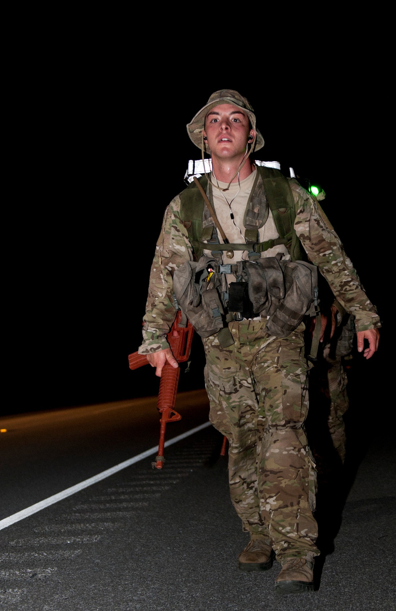 A Special Tactics candidate paces himself during a 12-mile ruck march in Fort Walton Beach, Fla., Sept. 13, 2013. The Special Tactics candidates had four hours to complete the ruck march, which is one of the final tests they must pass before graduating technical school. (U.S. Air Force photo/Senior Airman Krystal M. Garrett)