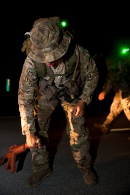 A Tactical Air Control Party candidate prepares for a 12-mile ruck march in Fort Walton Beach, Fla., Sept. 13, 2013. (U.S. Air Force photo/Senior Airman Krystal M. Garrett) 

