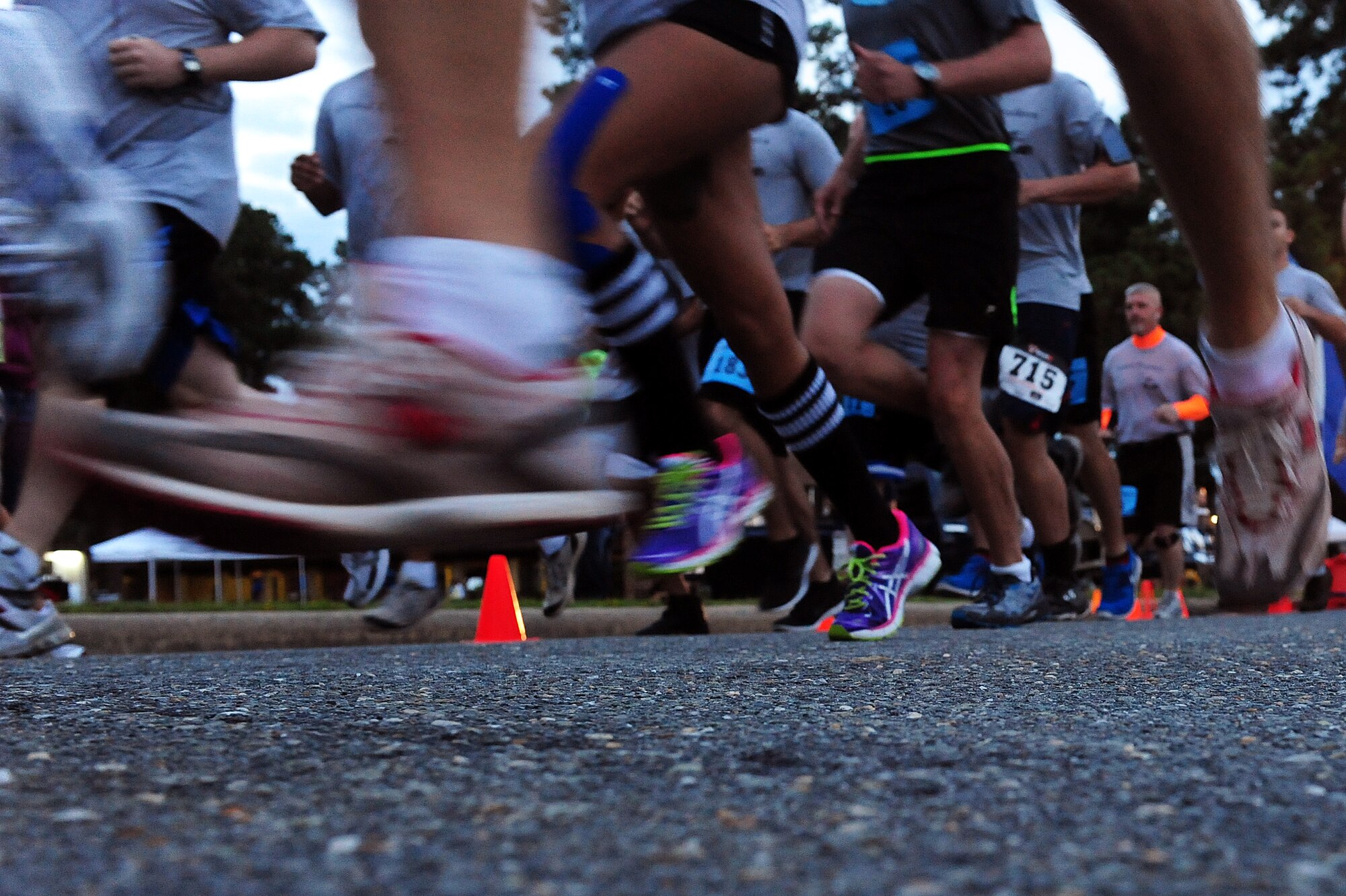Participants take off during the Run for the Fallen 5K/Half-Marathon, hosted by the 4th Fighter Wing Company Grade Officers’ Council, a private organization made up of Air Force lieutenants and captains, at Seymour Johnson Air Force Base, N.C., Sept. 14, 2013.  The event raised more than $10,000 for the Wounded Warrior Project, which offers a variety of programs to aid injured Service members.  (U.S. Air Force photo by Airman 1st Class Brittain Crolley)